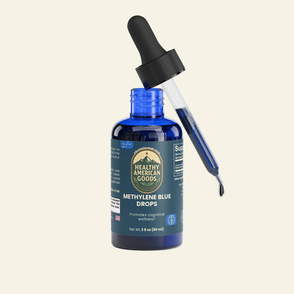 Methylene Blue drops bottle with black dropper cap, blue glass container