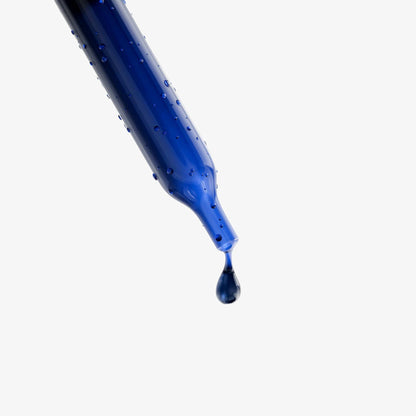 Dropper dispensing a blue drop from Methylene Blue drops bottle