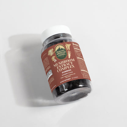 Mushroom extract complex supplement bottle, white cap, label facing camera on white