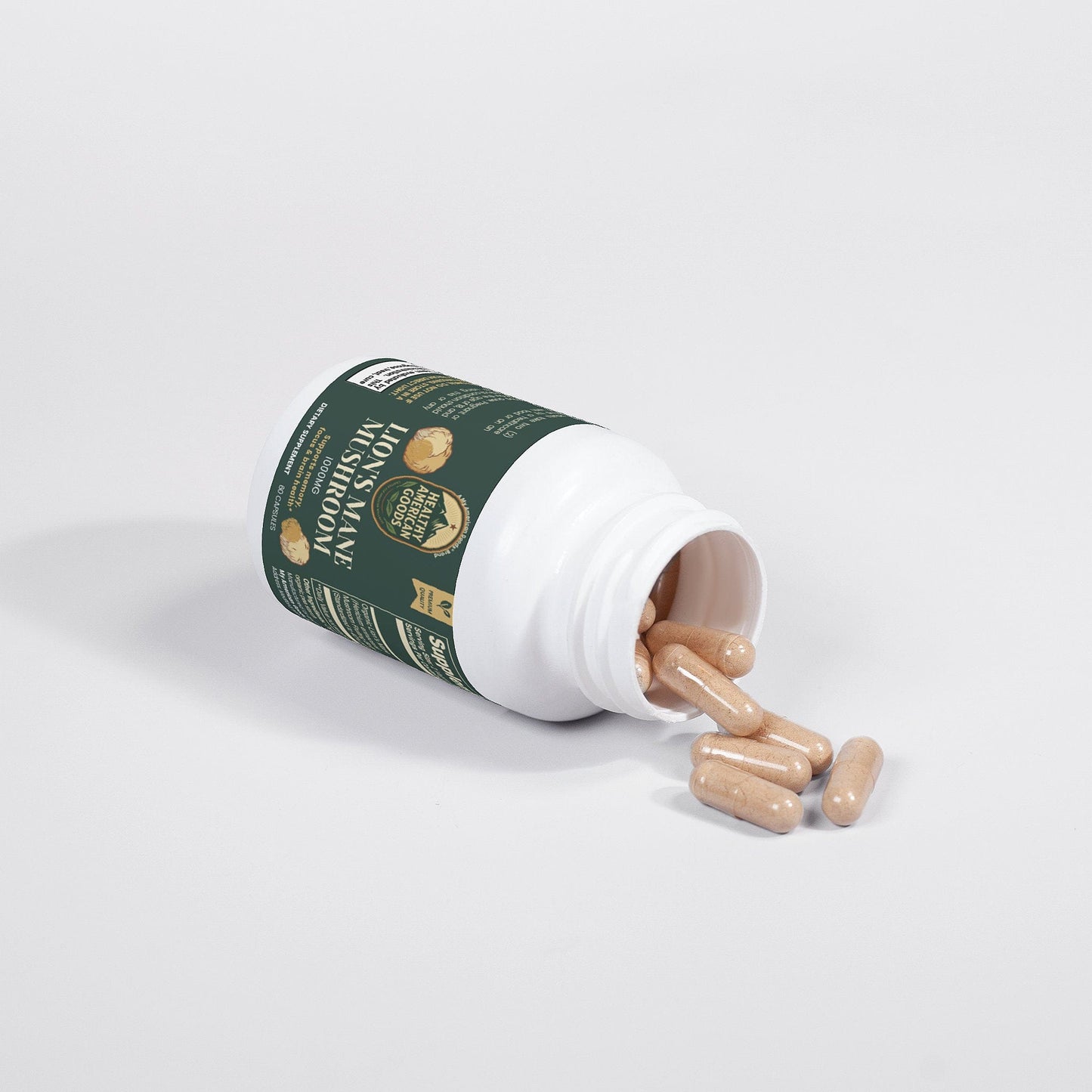 Mushroom supplement bottle tipped with beige capsules spilling onto surface