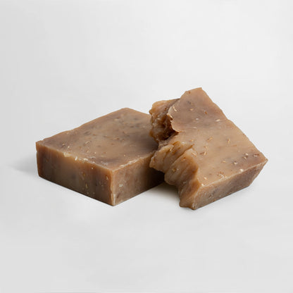 Oat milk & honey soap bar, two pieces of dark brown soap with rough edge