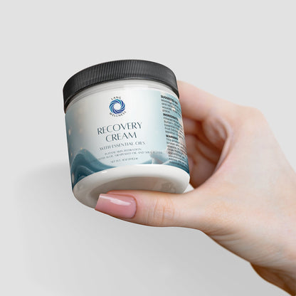 Recovery Cream jar in hand, front label visible, black lid