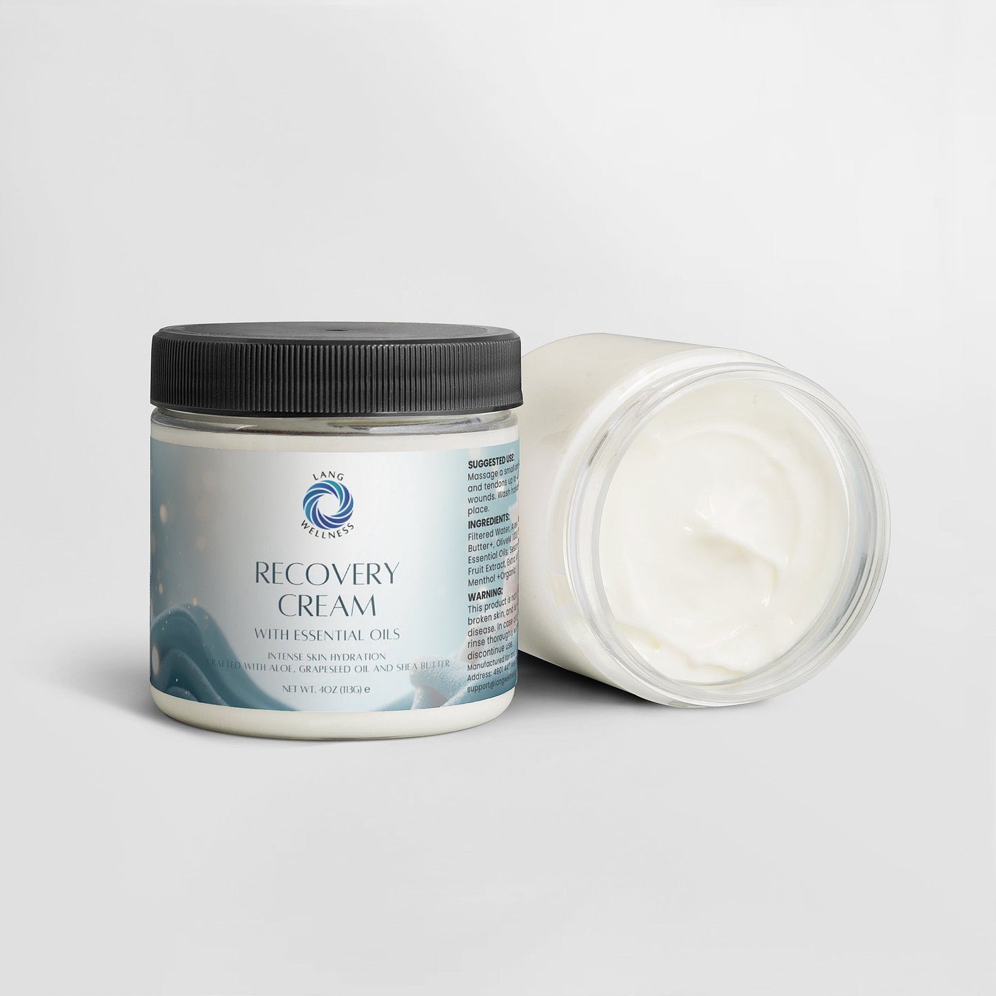 Recovery cream jar with black lid; open container shows thick white cream inside