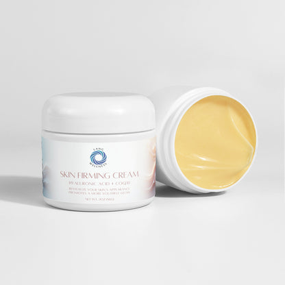 Skin firming cream jar with lid off beside closed jar, yellow cream visible