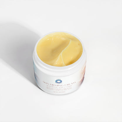 Skin firming cream jar open, showing smooth yellow cream inside