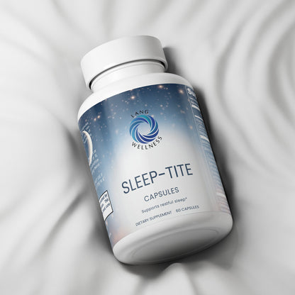 Capsules bottle with white cap and blue label on light fabric
