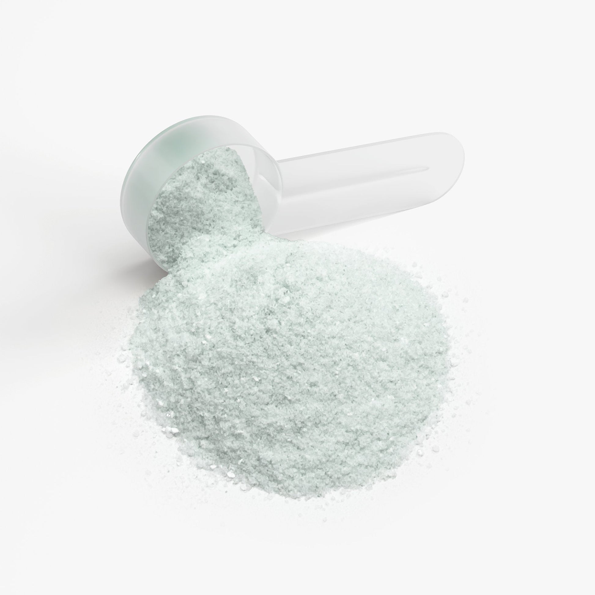 Jar with pale mint cap and spoonful of fine light-gray powder