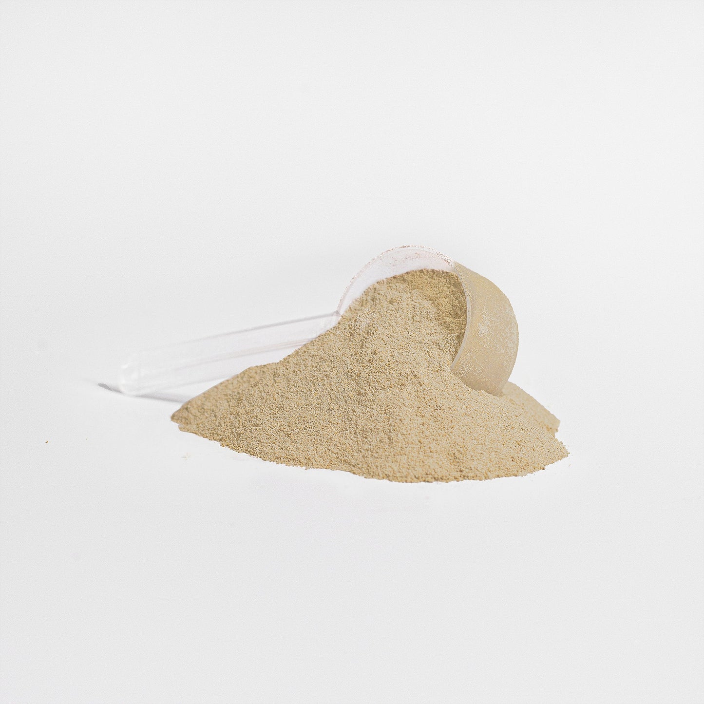 Vanilla protein powder, light beige heap with a fine dust stream