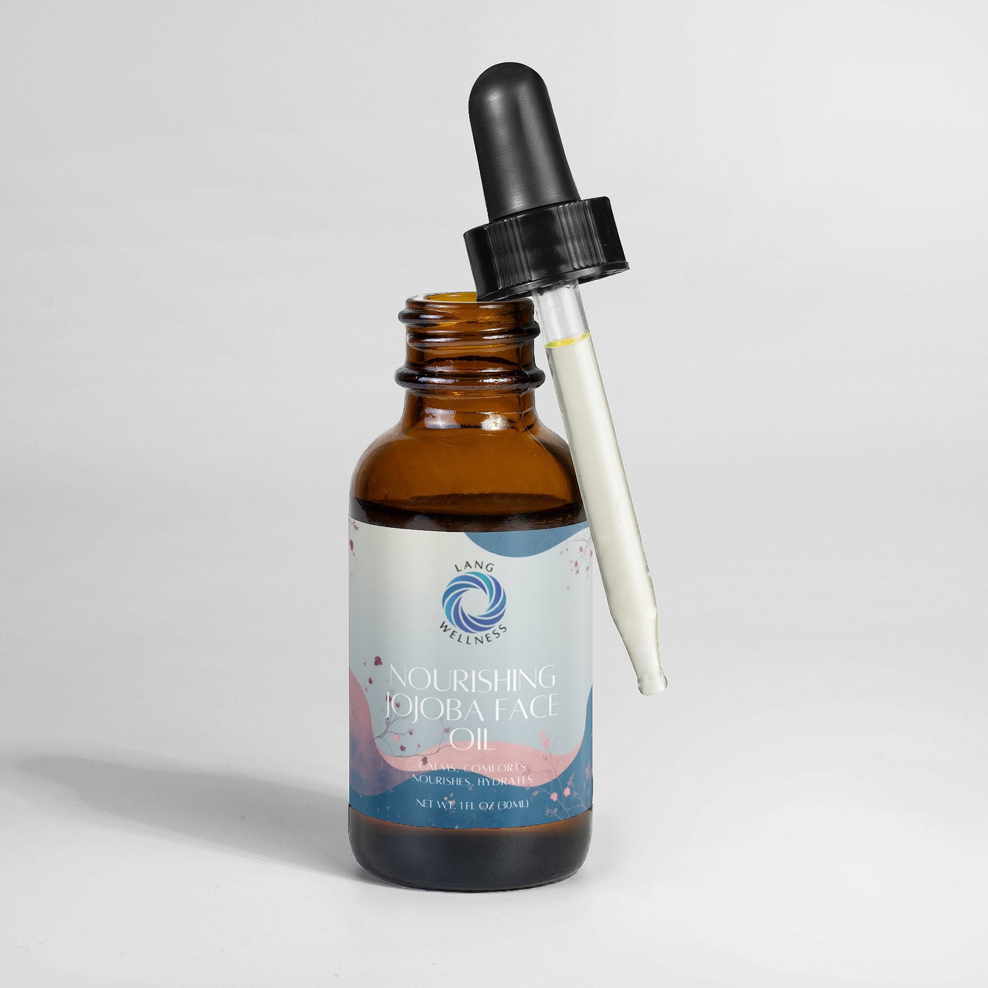 Jojoba face oil bottle with dropper showing clear oil