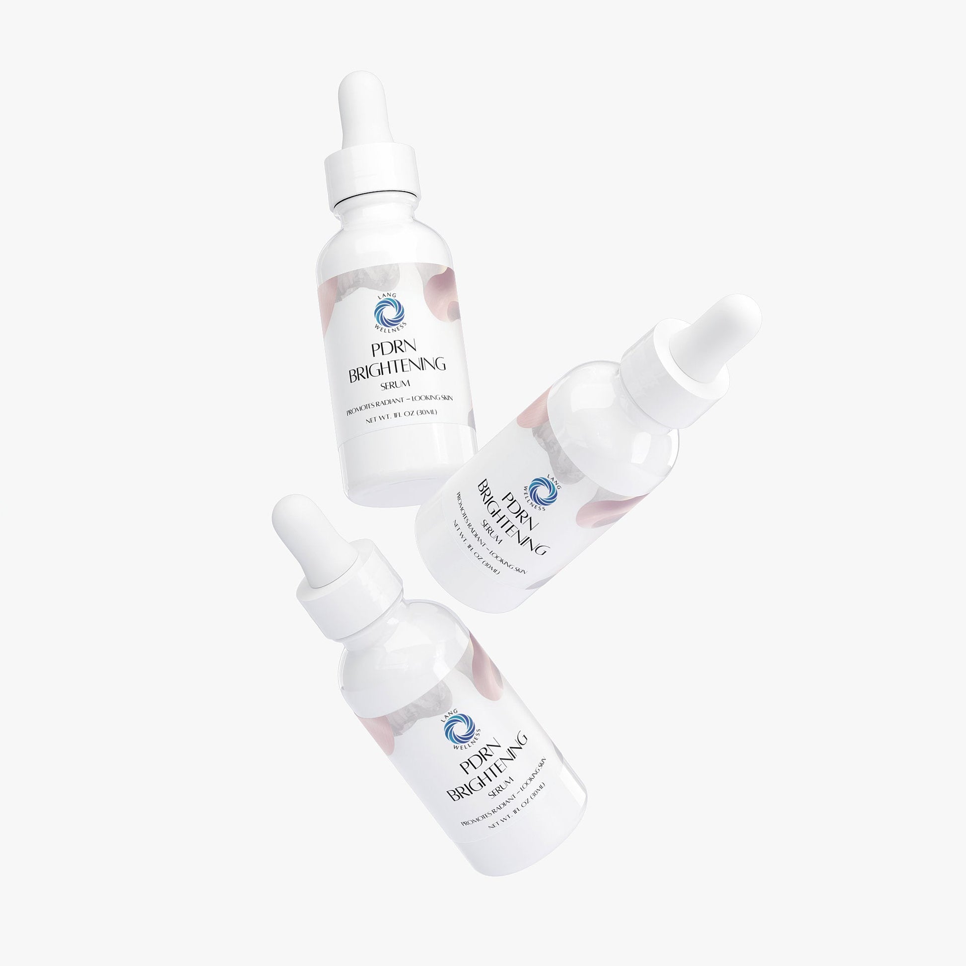 PDRN brightening serum set of bottles with droppers arranged diagonally