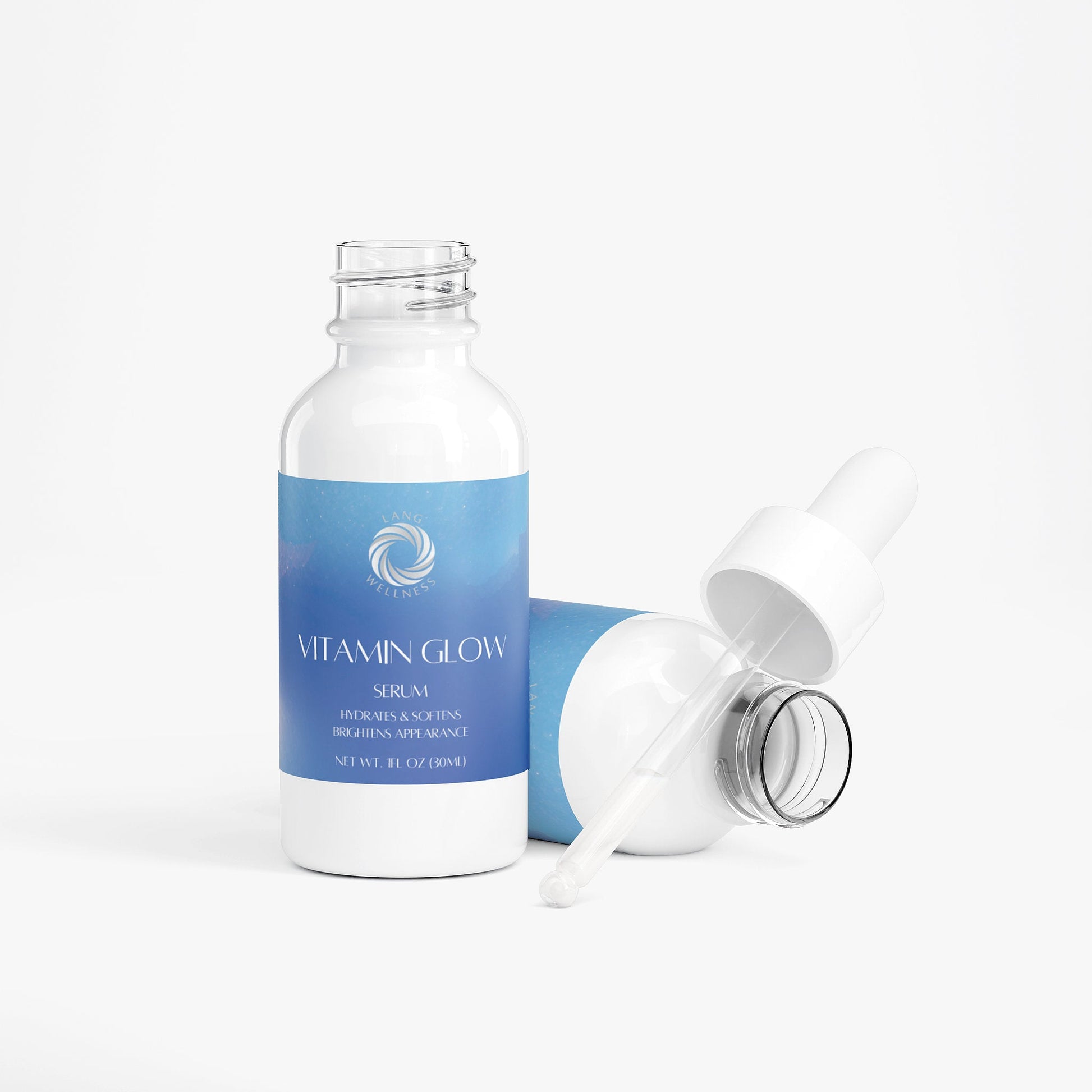 Vitamin glow serum bottle with detached dropper pipette, blue label
