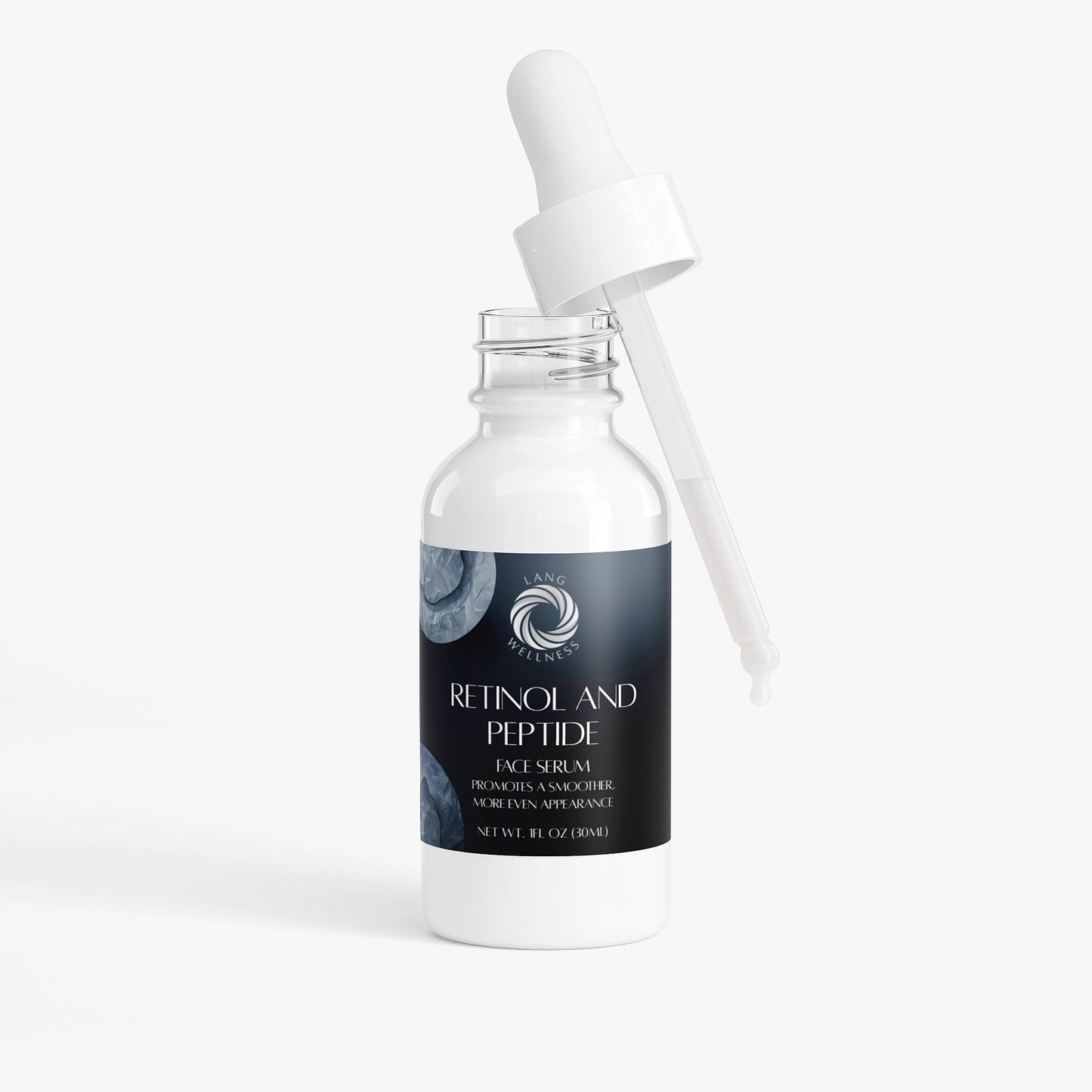 Face serum bottle with pump-style dropper accessory, studio view