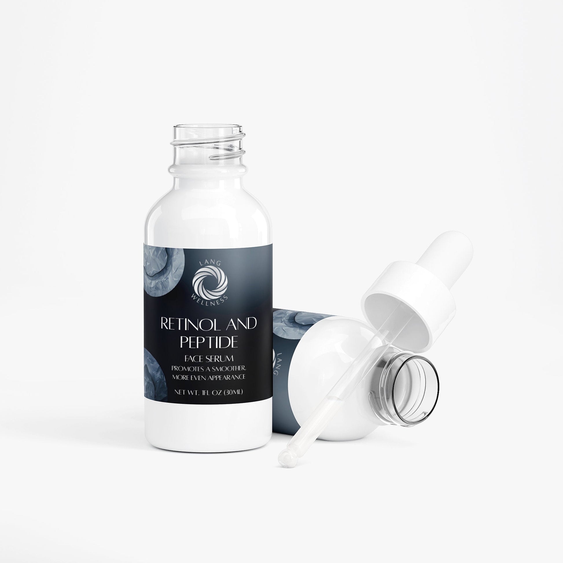 Face serum bottle with detached pump and open cap, studio view