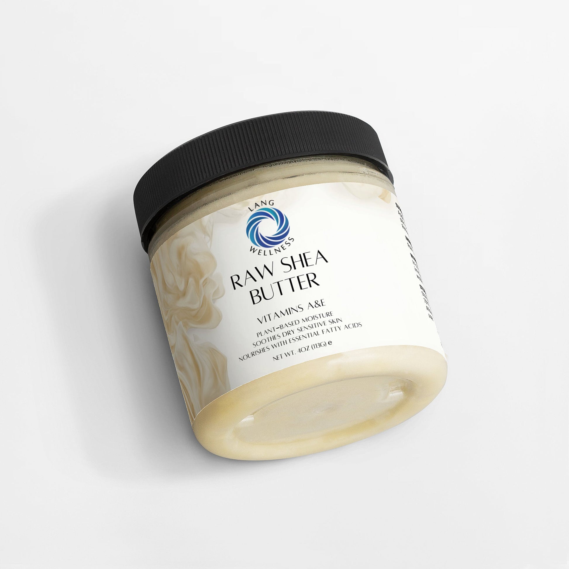 Tilting shea butter jar with black lid, cream visible at the open rim