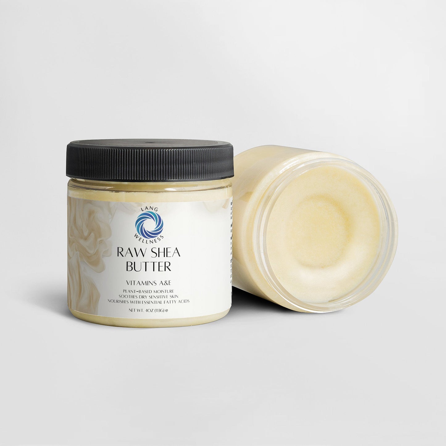 Shea butter jar with black lid and open lid showing pale cream inside