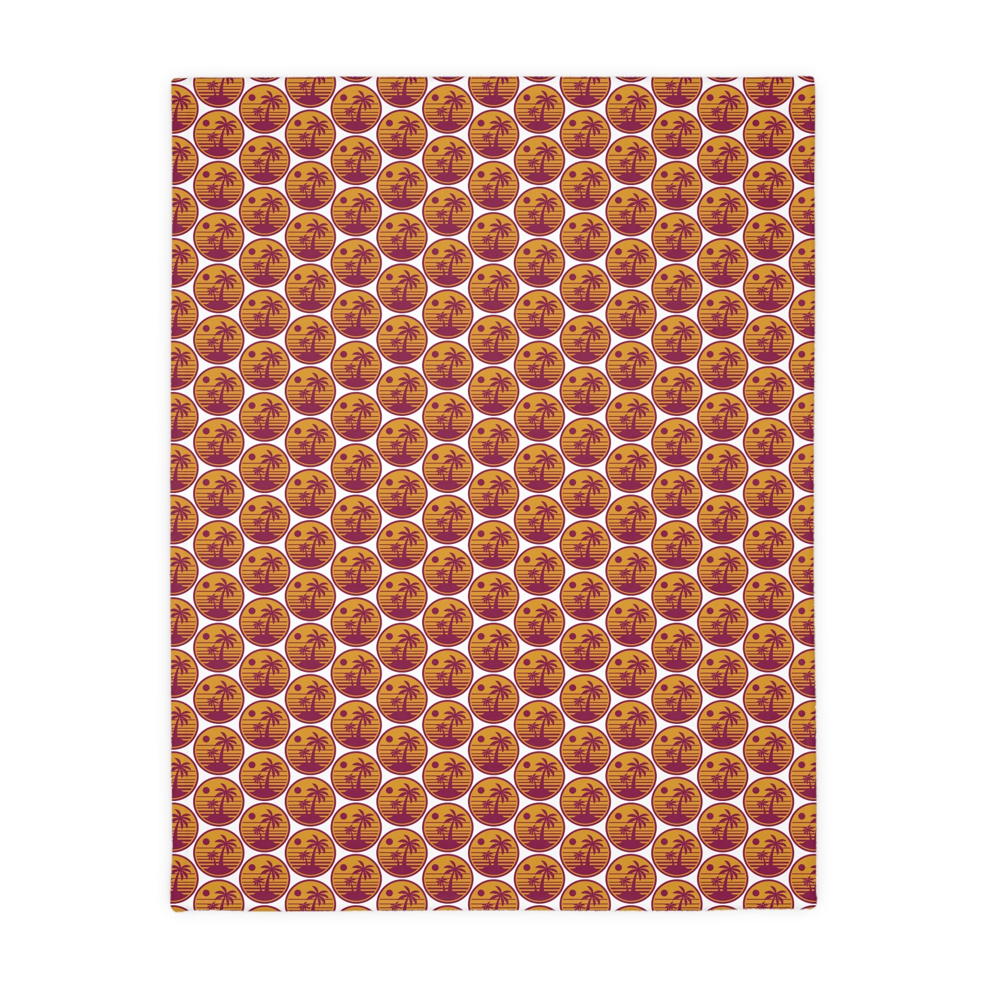 Square throw blanket with repeating pumpkin faces in orange, cream, and gold