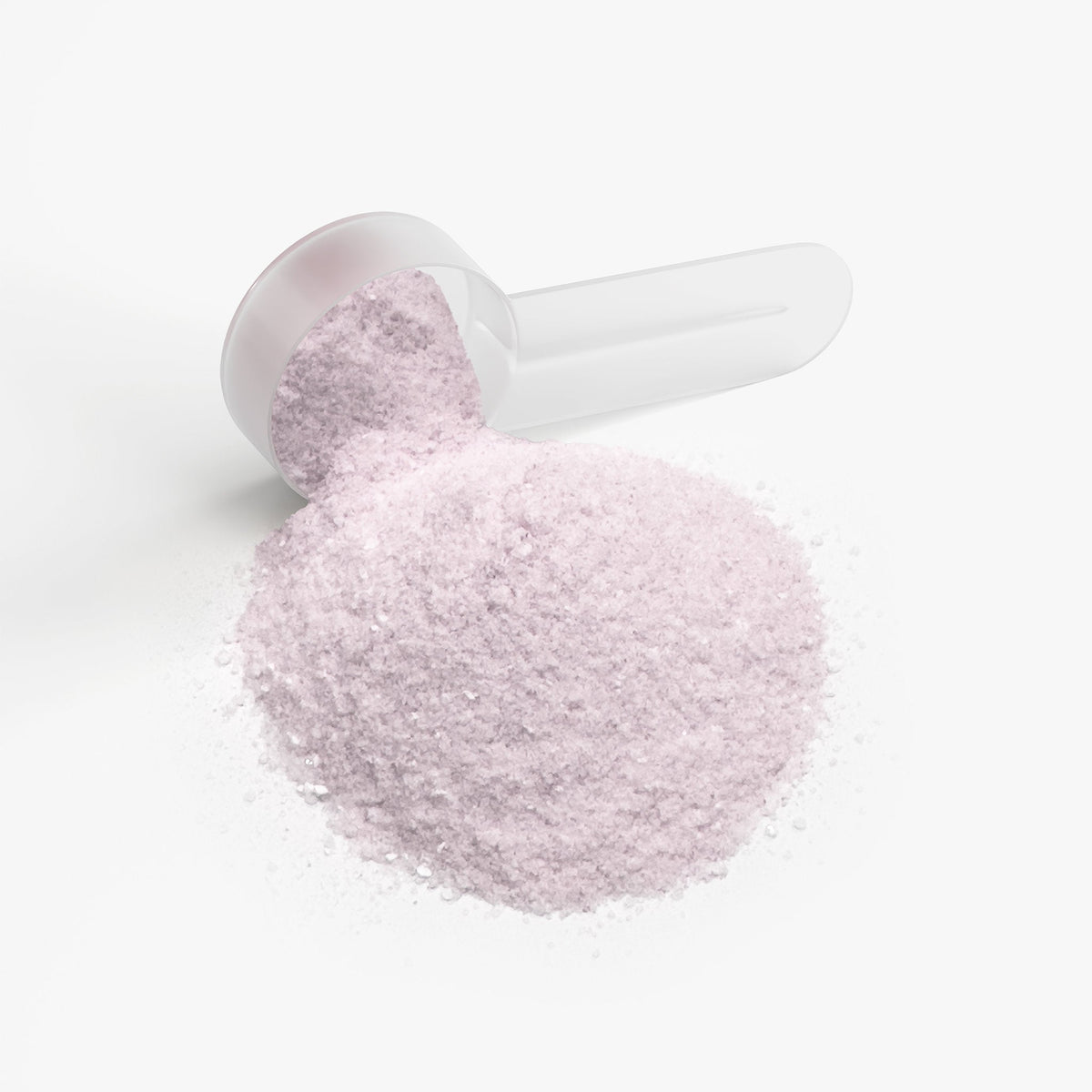 Measuring scoop filled with light purple energy powder