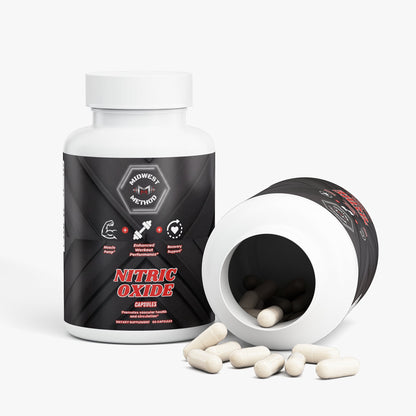 Supplement bottle beside open container, cream capsules spilling out