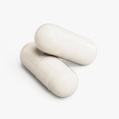 Cream-colored capsules, two lying side by side