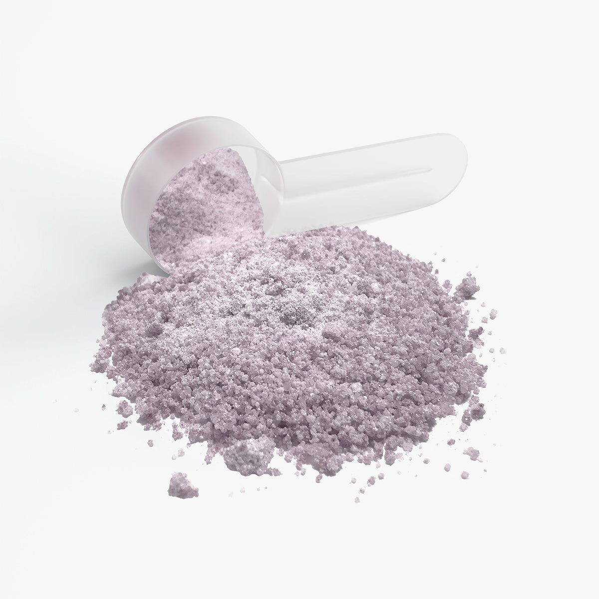 Sour grape energy powder scoop and mound of loose powder