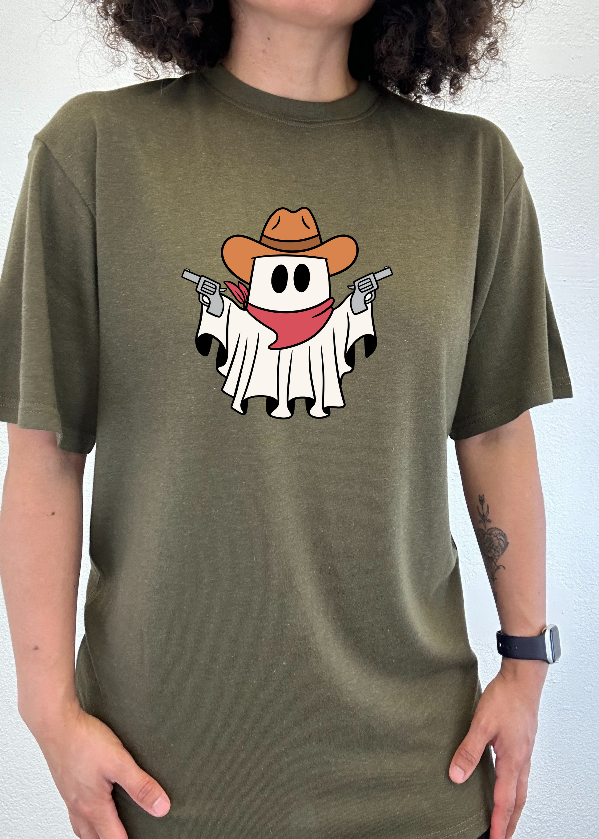Men's olive graphic T-shirt with cowboy ghost face and revolver print on front.