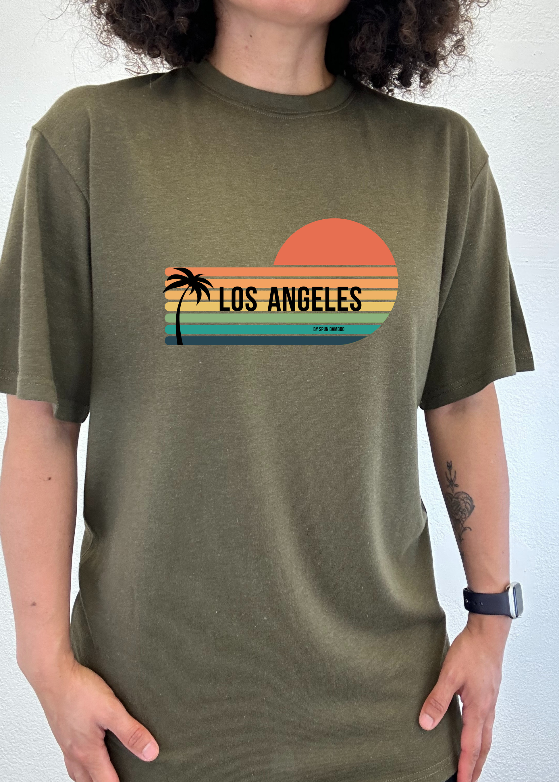 Unisex short-sleeve graphic T-shirt in olive green with Los Angeles sunset palm print