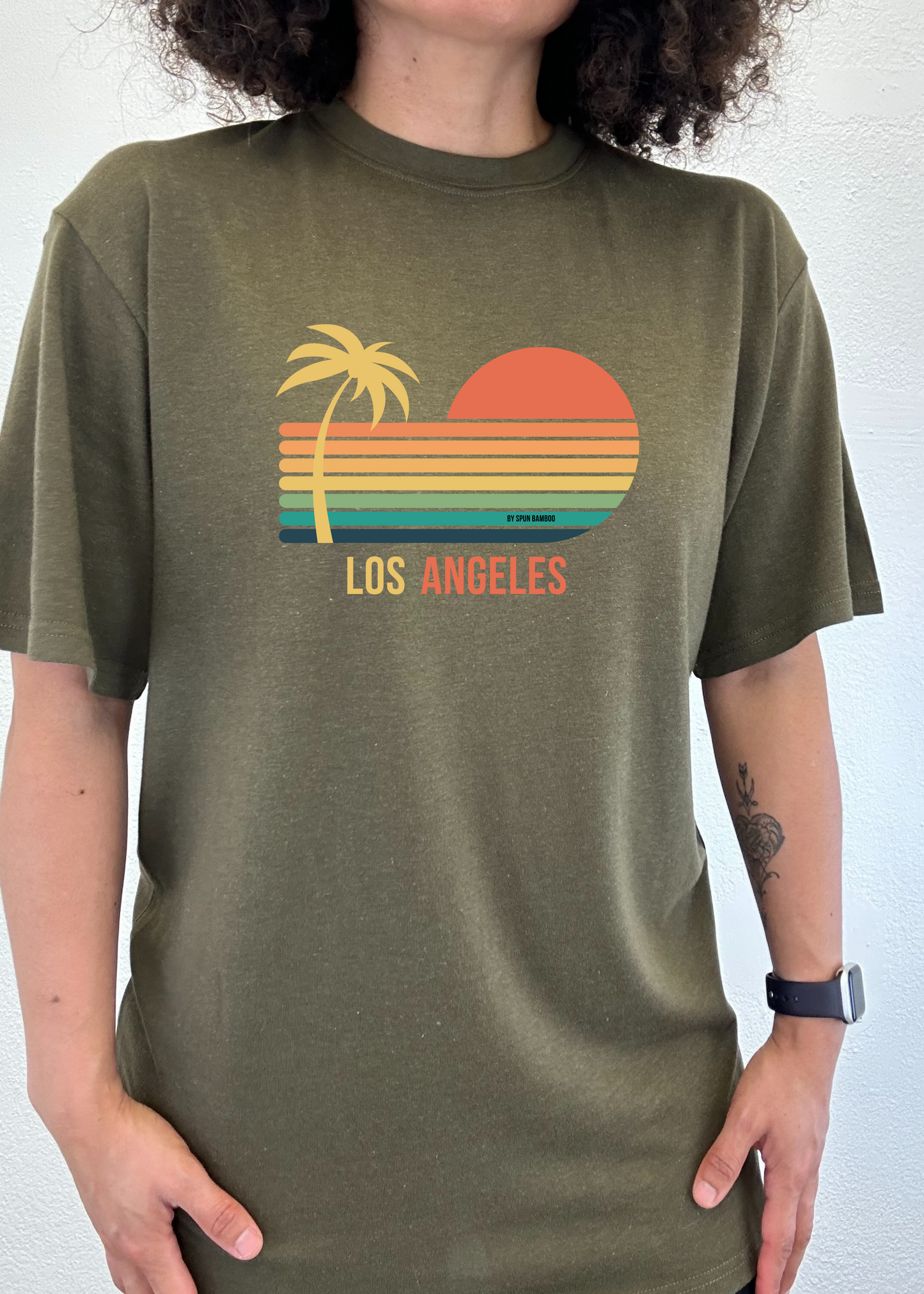 Olive green unisex graphic short-sleeve T-shirt with palm, sunset, and “Los Angeles” print