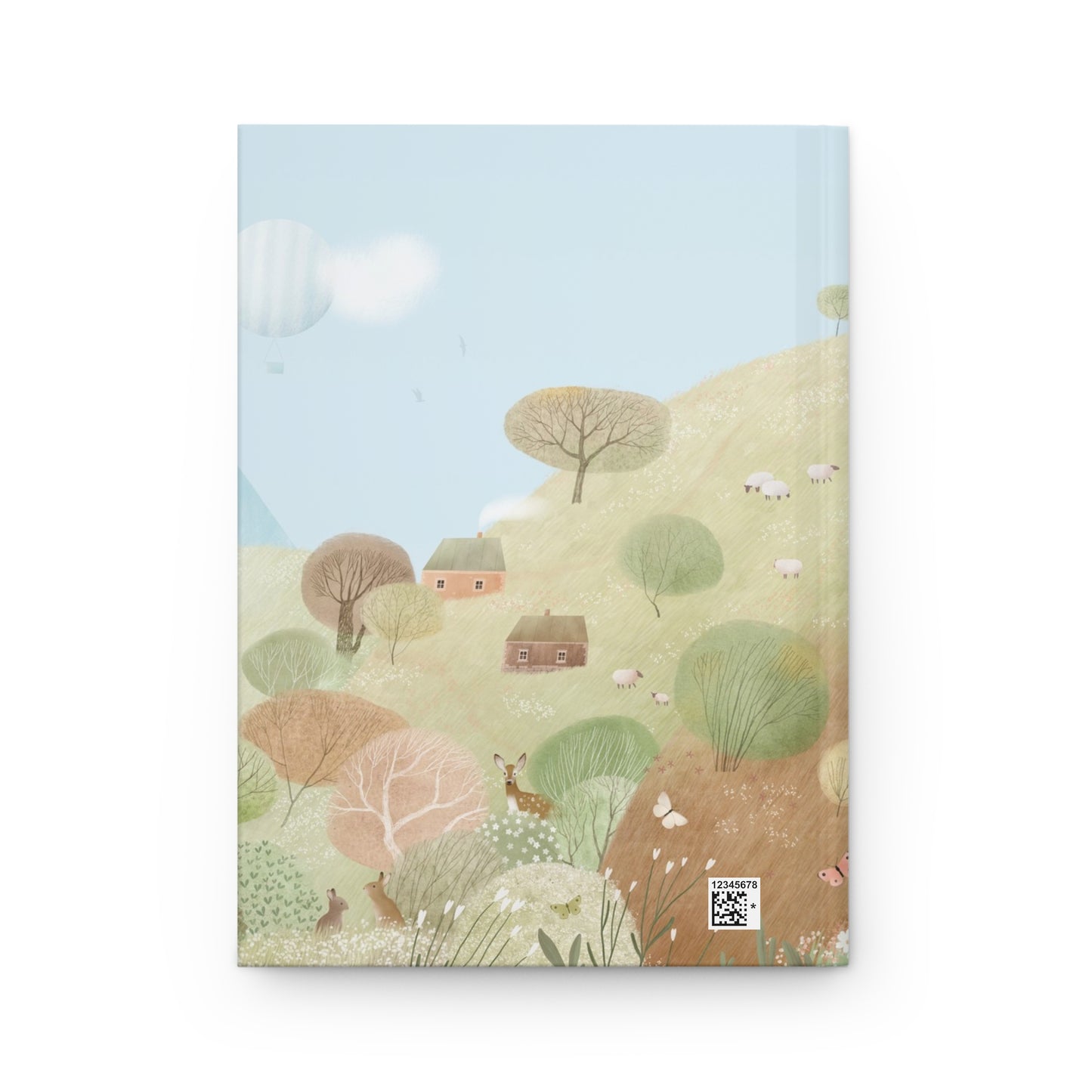 Hardcover journal with countryside hillside illustration—trees, houses, and rolling fields