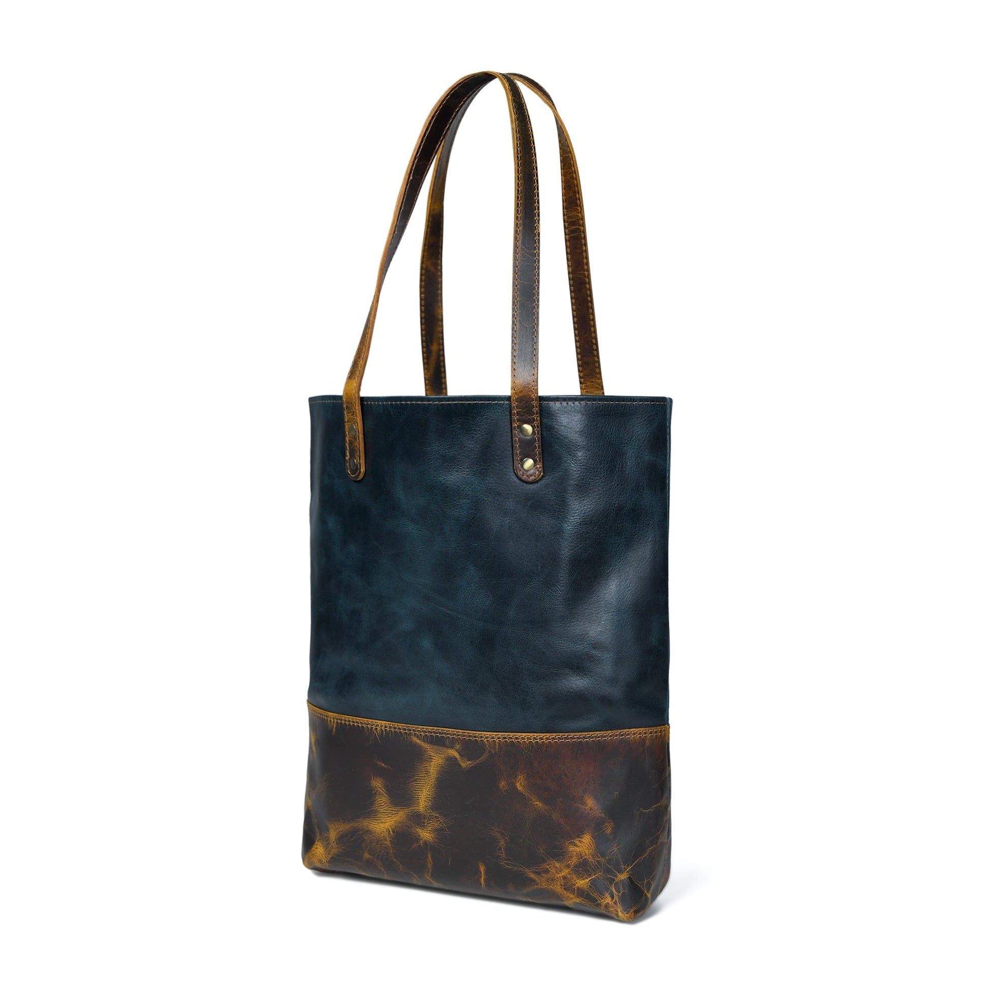 Dark blue leather tote with tan-brown bottom panel and twin top handles