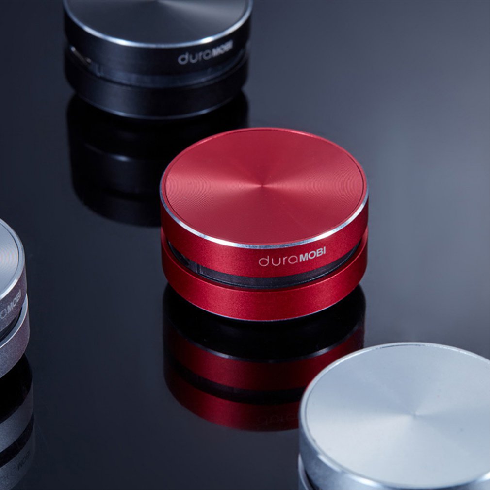 Red bone-conducting speaker stacked with black and silver speaker bases