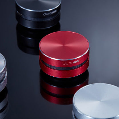 Red bone-conducting speaker stacked with black and silver speaker bases