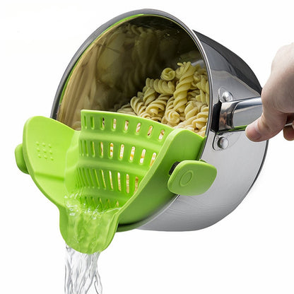 Green silicone snap-and-strain filter with perforated basket and snap handle