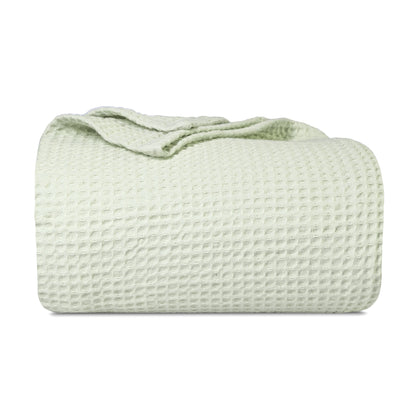 Waffle weave blanket roll, pale green with raised textured grid pattern