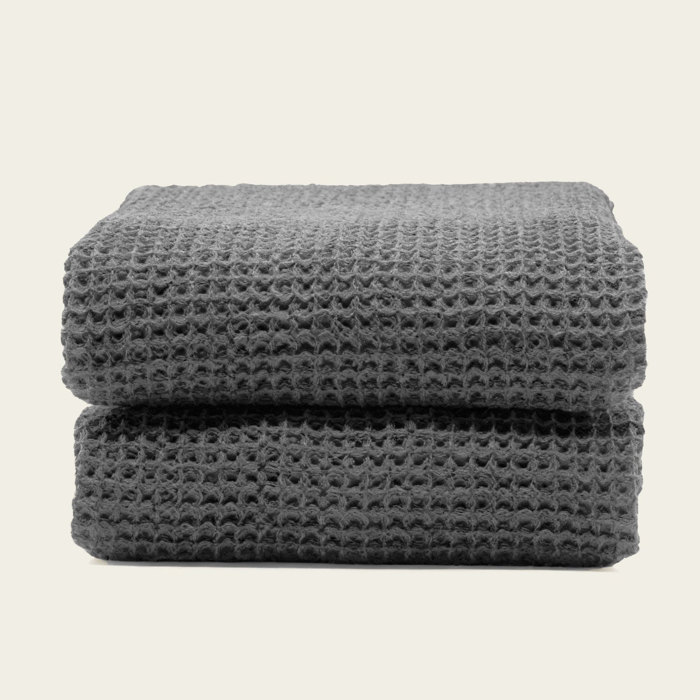 Australian cotton waffle towels in charcoal, folded and stacked