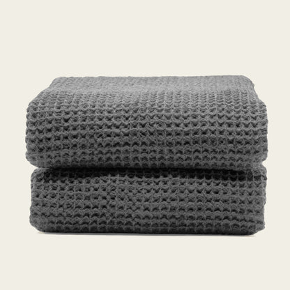 Australian cotton waffle towels in charcoal, folded and stacked