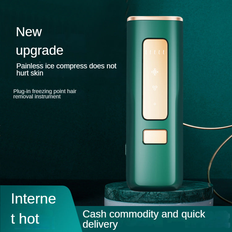Green handheld laser hair remover with gold-toned control panel and side button
