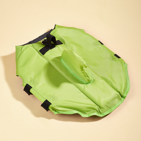 Dog life vest in bright green with black straps and front D-ring