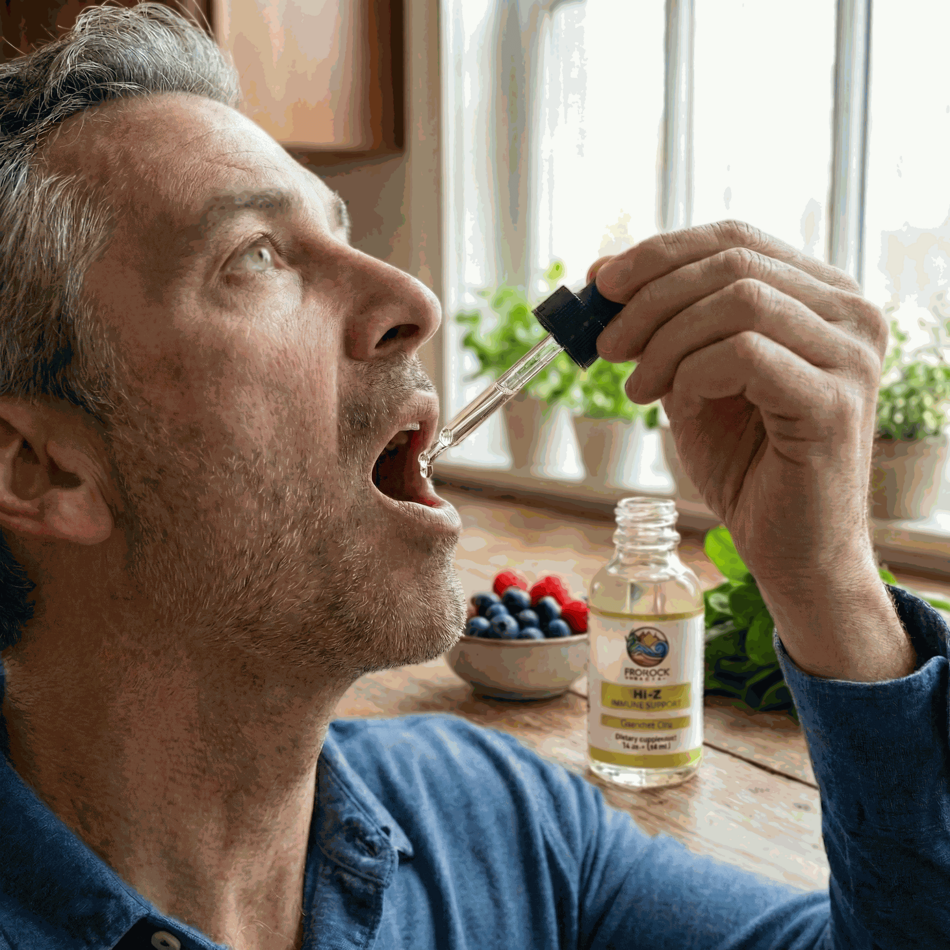 Man holding a dropper with a liquid zinc supplement bottle nearby