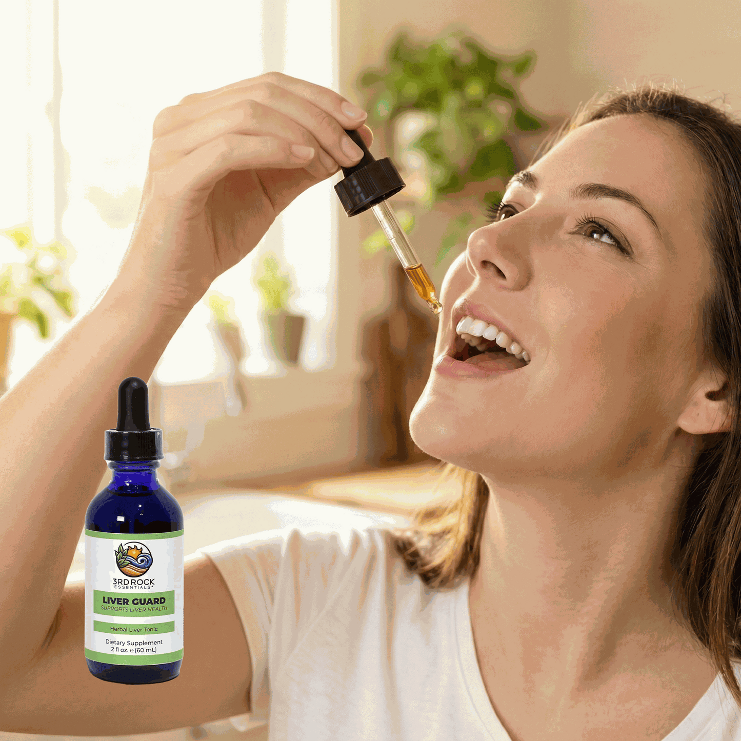 Liver Guard supplement bottle with dropper, amber oil being dispensed