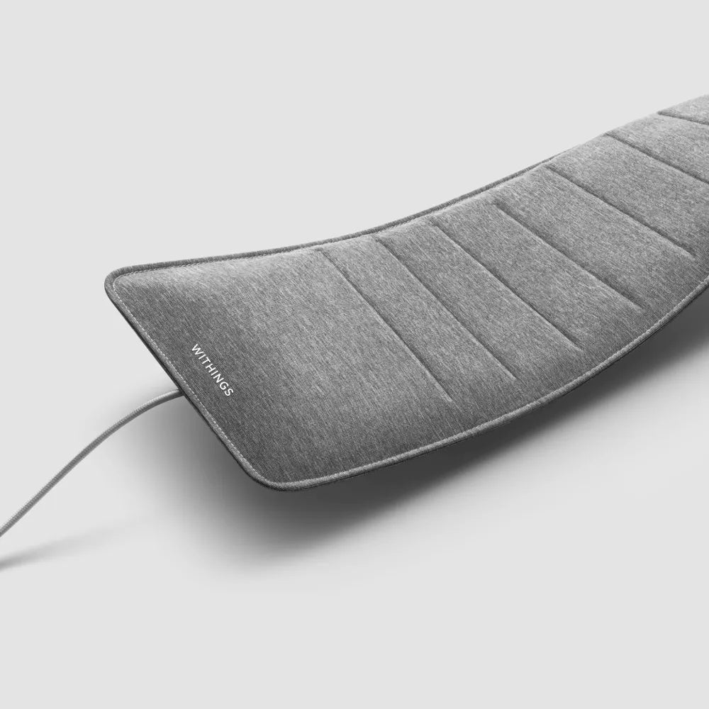Withings sleep tracking mat, grey fabric with cord on the side