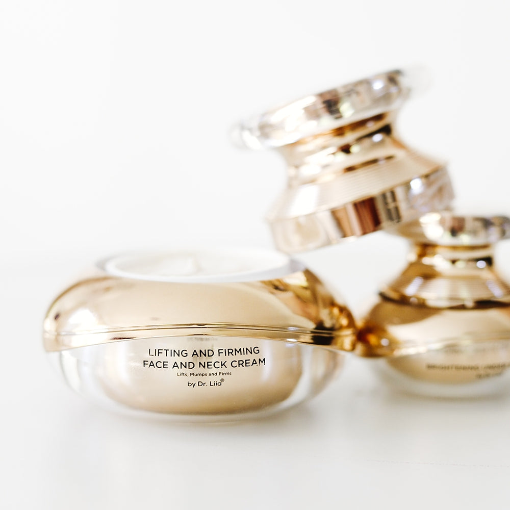 Under eye cream jar with open lid and another cream jar blurred behind.