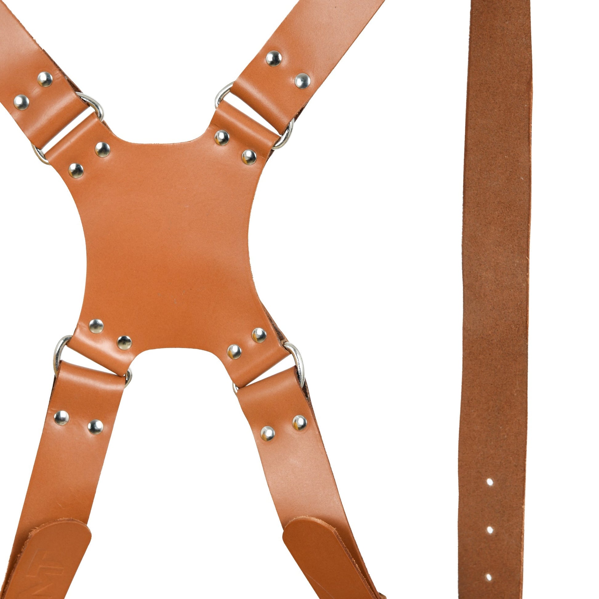 Tan brown leather harness cross straps with riveted metal studs