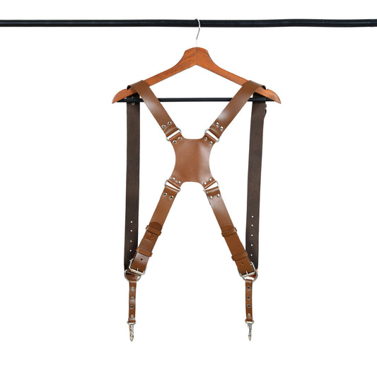 Brown leather double-strap camera harness with metal D-rings and hanging clips