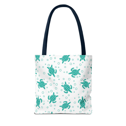 Sea turtle print tote bag with teal turtles on white, navy carry handles