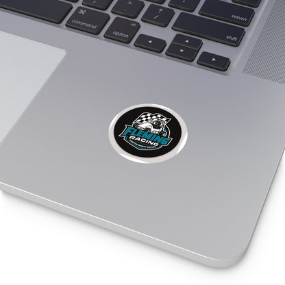 Round black vinyl logo sticker on a silver laptop lid
