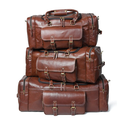 Stacked brown leather weekender duffel pair with buckled front pockets and handles