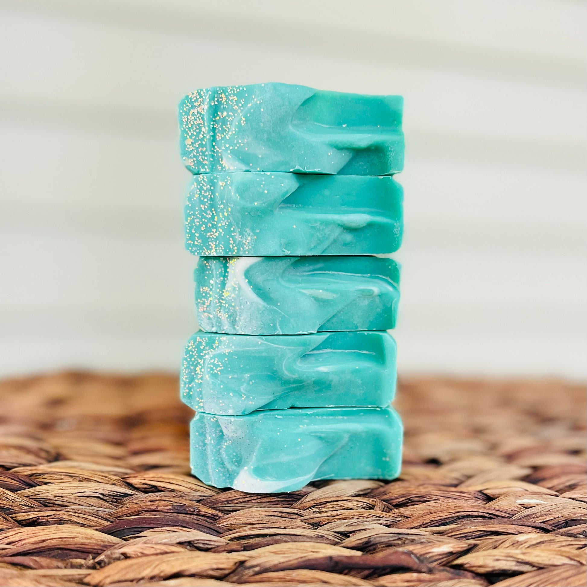 Teal layered soap bar stack with glittery speckles