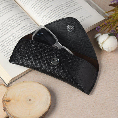 Black textured leather sunglasses cover, open showing eyeglass frame inside