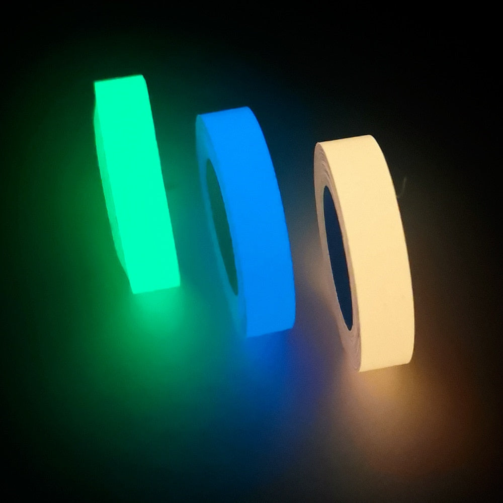 Glow-in-the-dark sticker tape rolls in green and blue with glowing edges