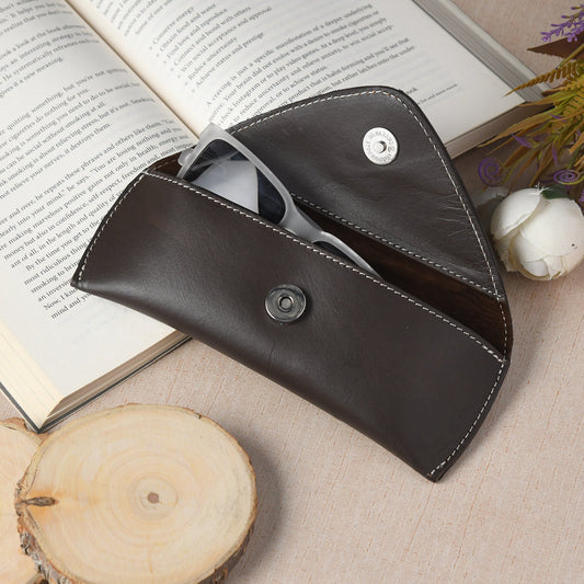 Dark brown leather sunglasses case with snap button and white contrast stitching